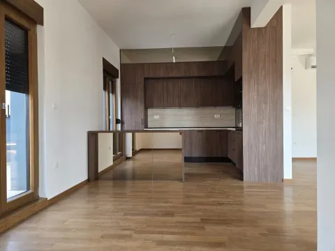 Modern kitchen with wooden elements and parquet flooring. - image 10