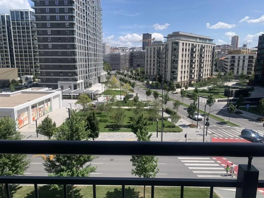 View from the terrace overlooking city streets and surrounding buildings.