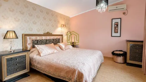 Bright bedroom with a large double bed and a nightstand. - image 7