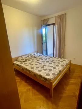 Bedroom with a double bed, parquet flooring, and access to the terrace. - image 9