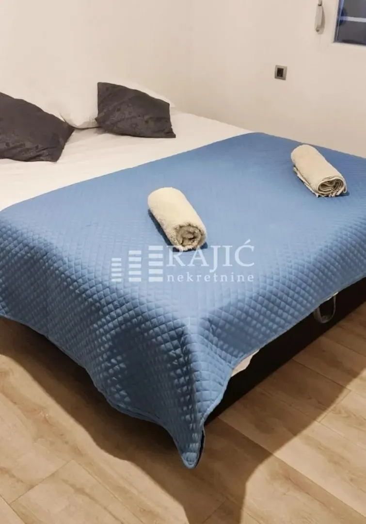 Furnished bedroom with a double bed.