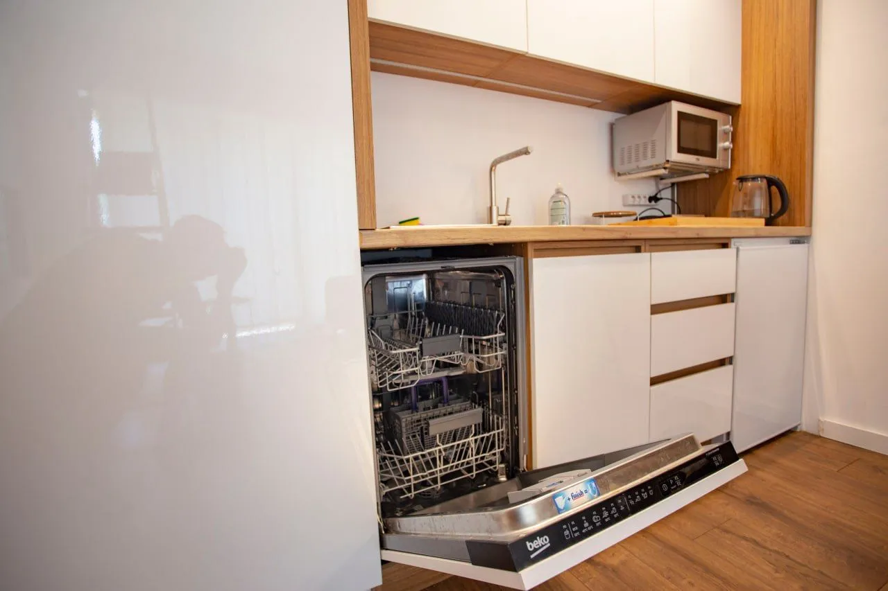 Modern kitchen with an open dishwasher.
