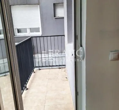 View of a smaller balcony with ceramic tiles and a railing. - image 7