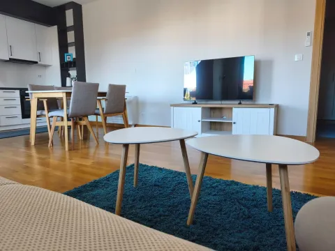 Living room with dining area and modern furniture. - image 3