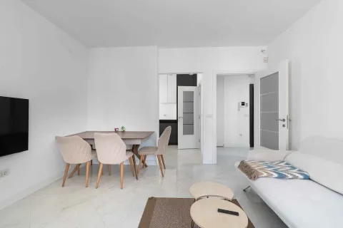 Bright living room with dining area and sofa. - image 7