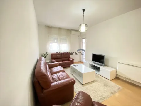 Furnished living room with leather sofas and a television. - image 4