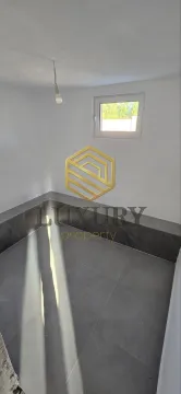 Empty room with a window and tiled floor. - image 3