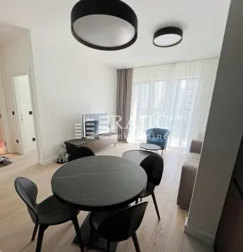 Living room with dining area and modern furniture. - image 3