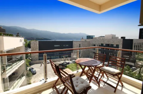 Furnished balcony with seating set and view of the sea and mountains. - image 11