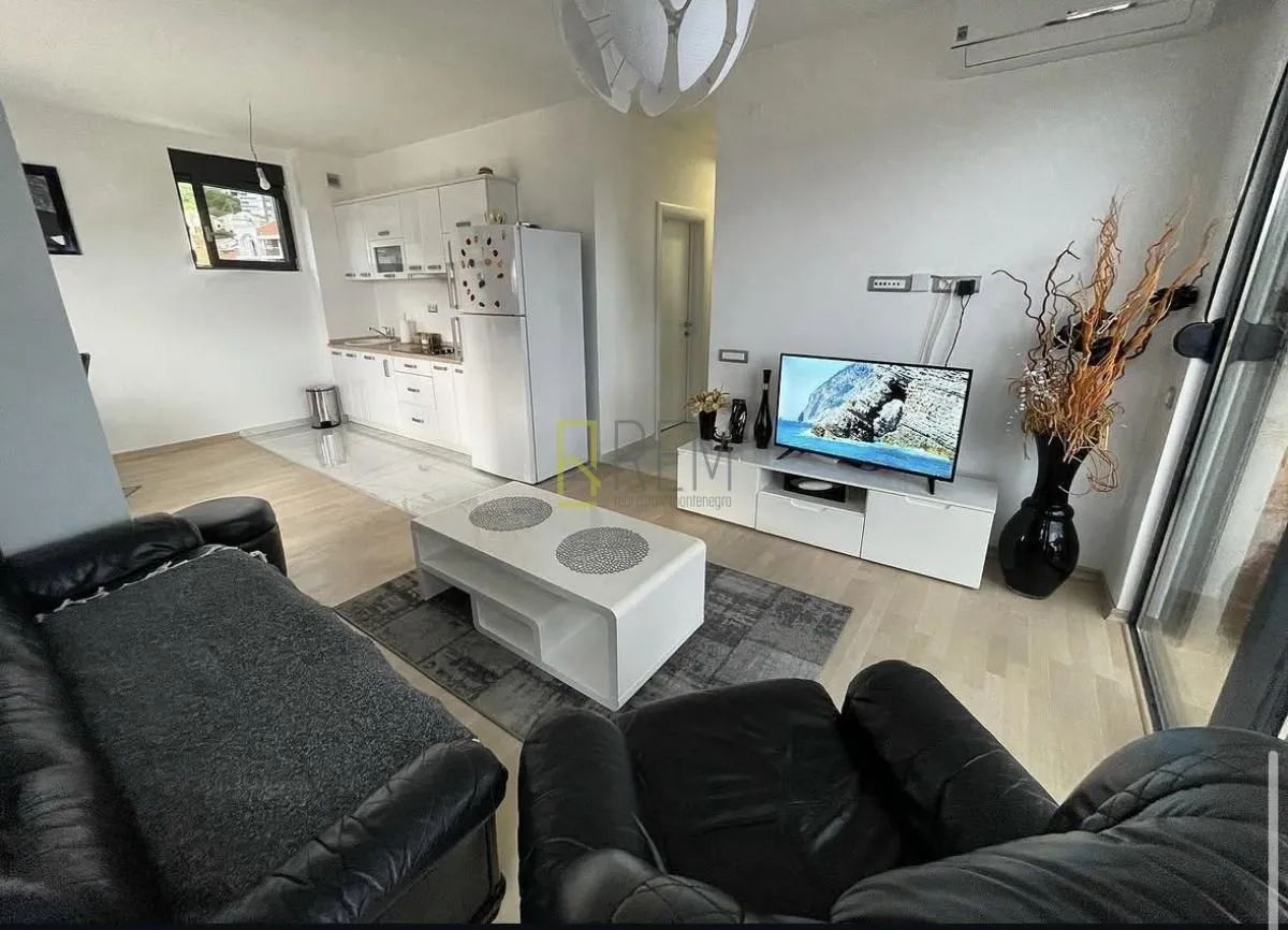 Living room connected to the dining area and kitchen.