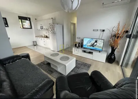 Living room connected to the dining area and kitchen. - image 2