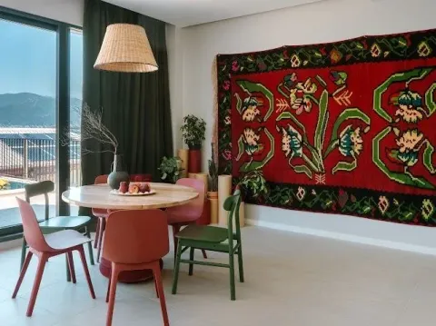 Bright living room with a dining table and a large window with a view. - image 3