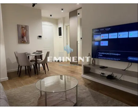 Living room with dining area and TV. - image 12
