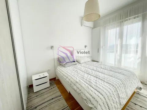 Bright bedroom with a double bed, nightstand, and access to the terrace. - image 6