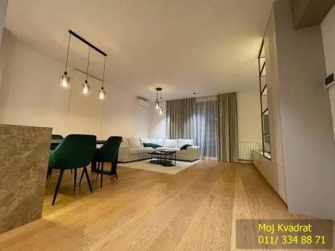 Living room with dining area and modern lighting. - image 8