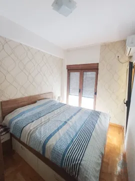 Bedroom with a double bed and a window. - image 5