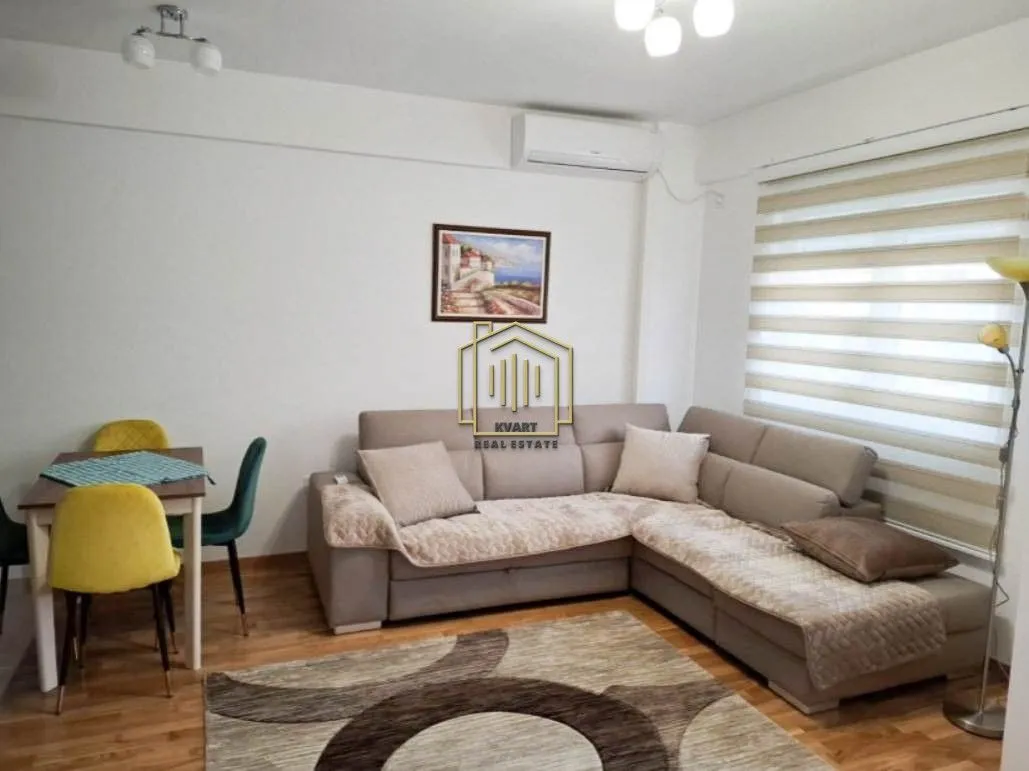 Living room with a sofa set and a dining table.