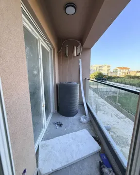Unfinished balcony with construction material. - image 12
