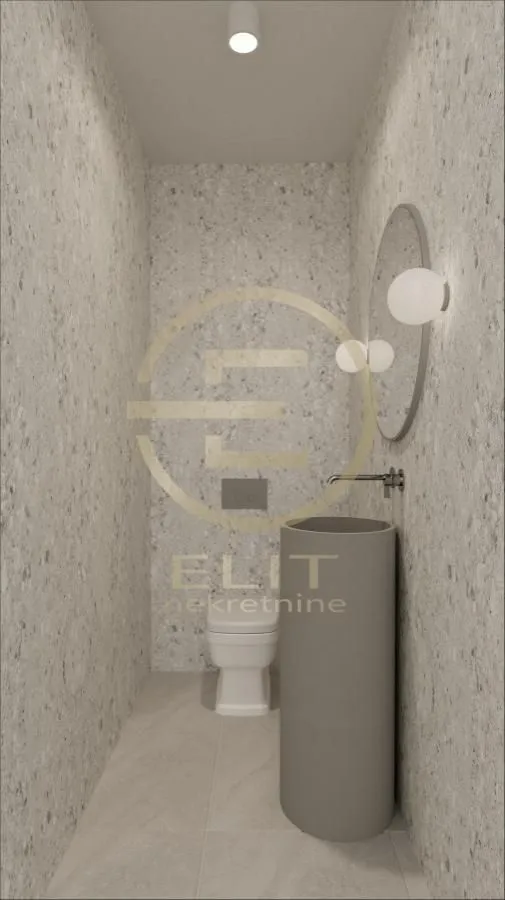Modernly equipped bathroom with a basin and a toilet.