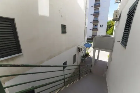 External passageway with stairs between buildings. - image 6