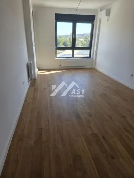 Empty bright room with wooden flooring and a window. - image 10