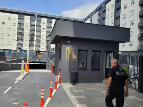 Security guardhouse and underground garage entrance in front of the residential building. - image 4