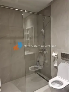 Modernly equipped bathroom with a walk-in shower and sanitary ware. - image 17