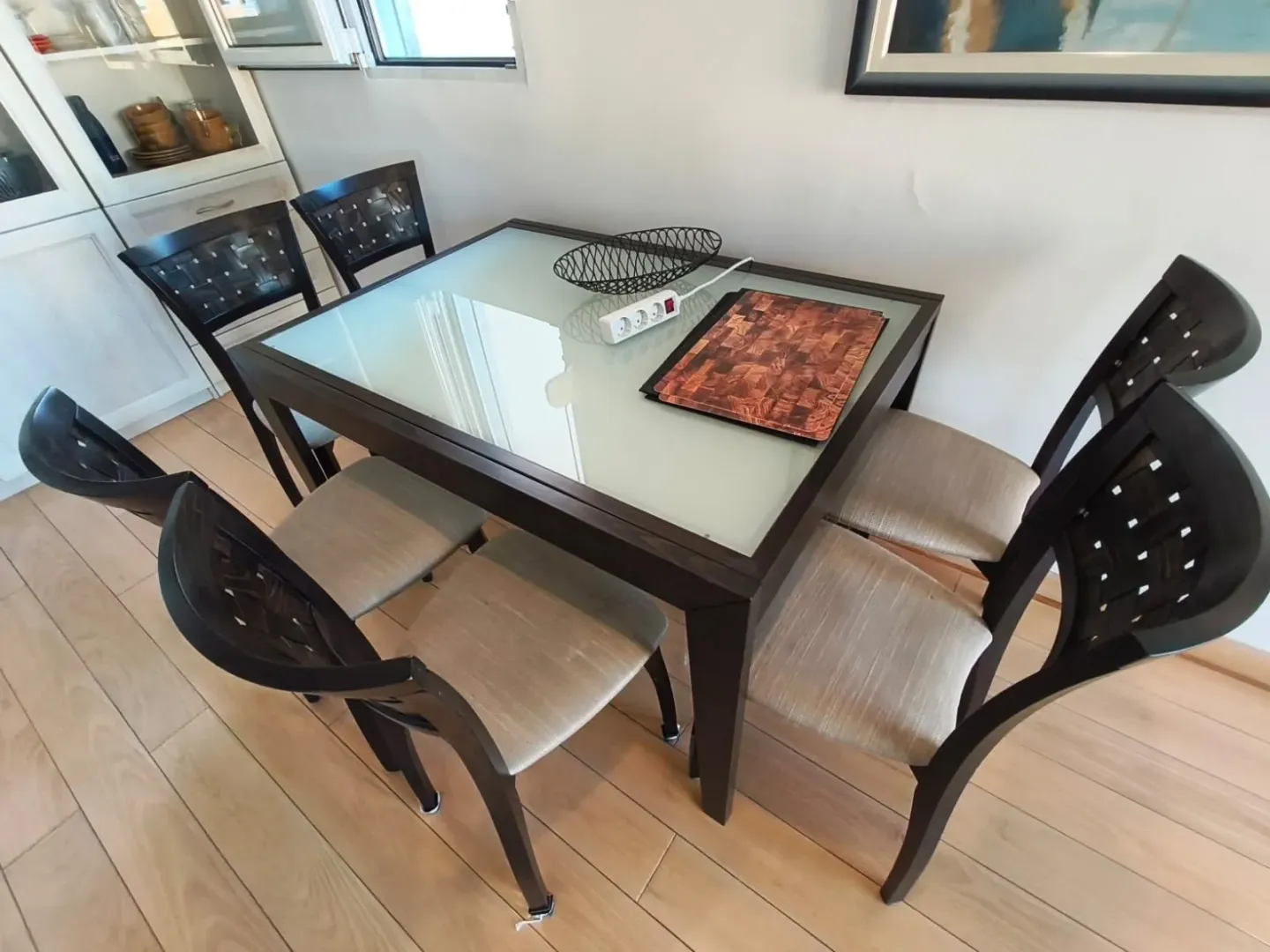 Dining table with chairs in the living room.