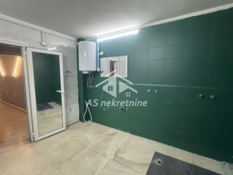 View of a bathroom with tiles and an installed water heater. - image 24