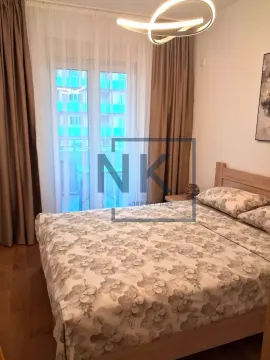 Furnished bedroom with a double bed and access to the terrace. - image 5