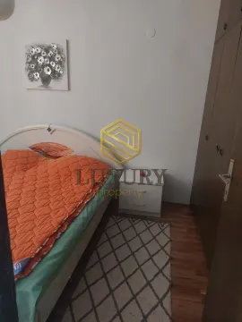 Bedroom with a double bed, wardrobe, and rug. - image 7