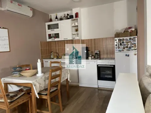 Kitchen with dining area and appliances. - image 2