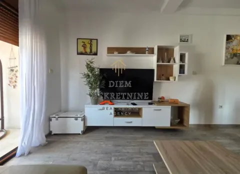 Living room with a TV unit and furniture. - image 15