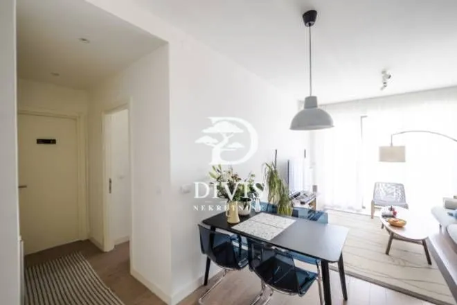 Living room with a dining area and access to the terrace.
