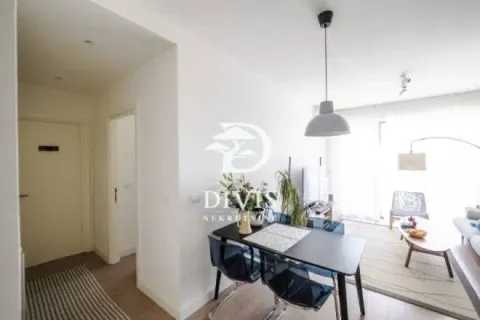 Living room with a dining area and access to the terrace. - image 16