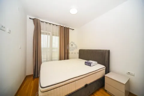 Bedroom with a double bed and a nightstand. - image 4