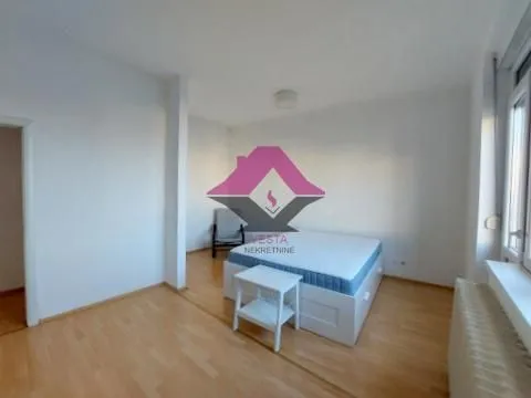 Bedroom with a double bed and wooden flooring. - image 6