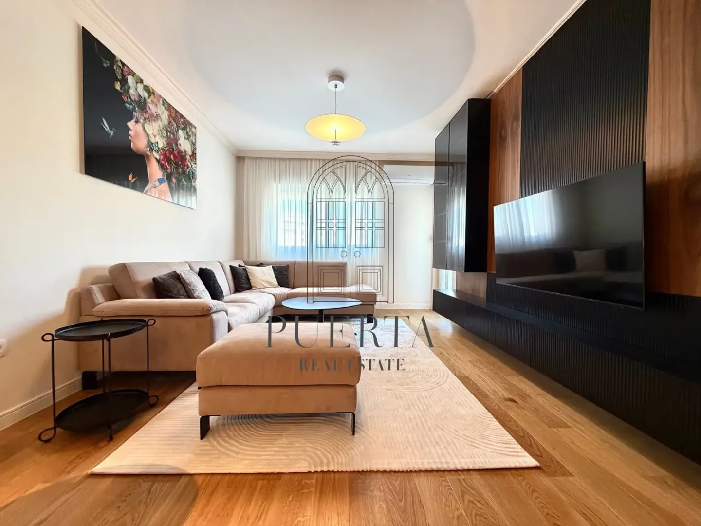 Modern living room with a sofa and television.