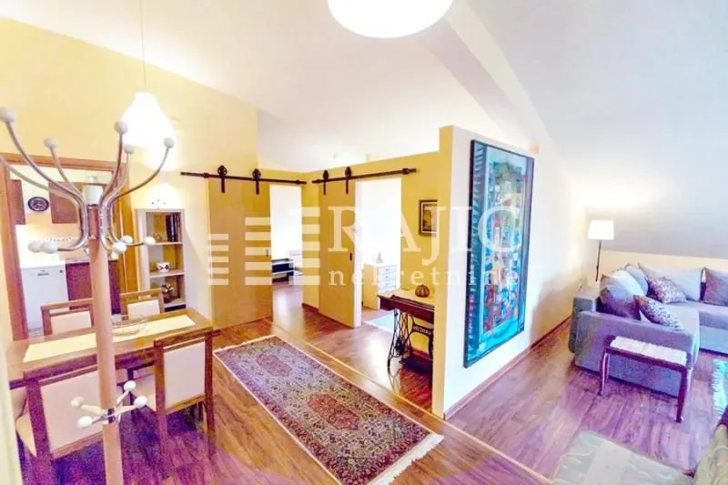 Living room with dining area and open concept in the attic.