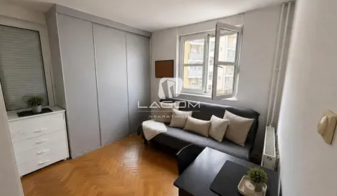 Smaller bedroom with a bed, wardrobe, and window. - image 12