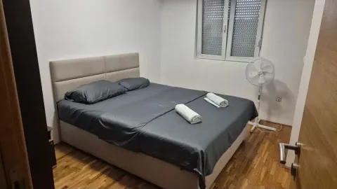 Furnished bedroom with a double bed. - image 8