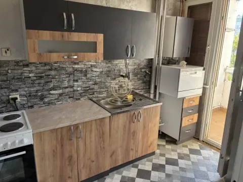 Small kitchen with sink, cabinets, and stove. - image 14