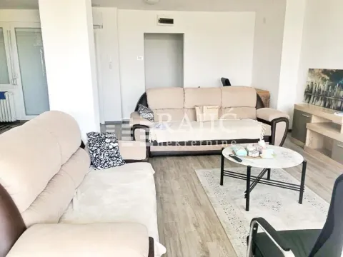 Living room with sofa set and coffee table. - image 3