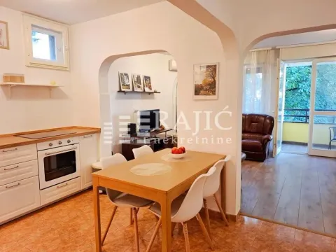 Kitchen with dining area and view of the living room. - image 11