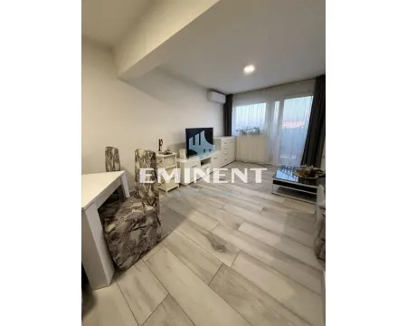 Living room with a dining table and access to the terrace. - image 3