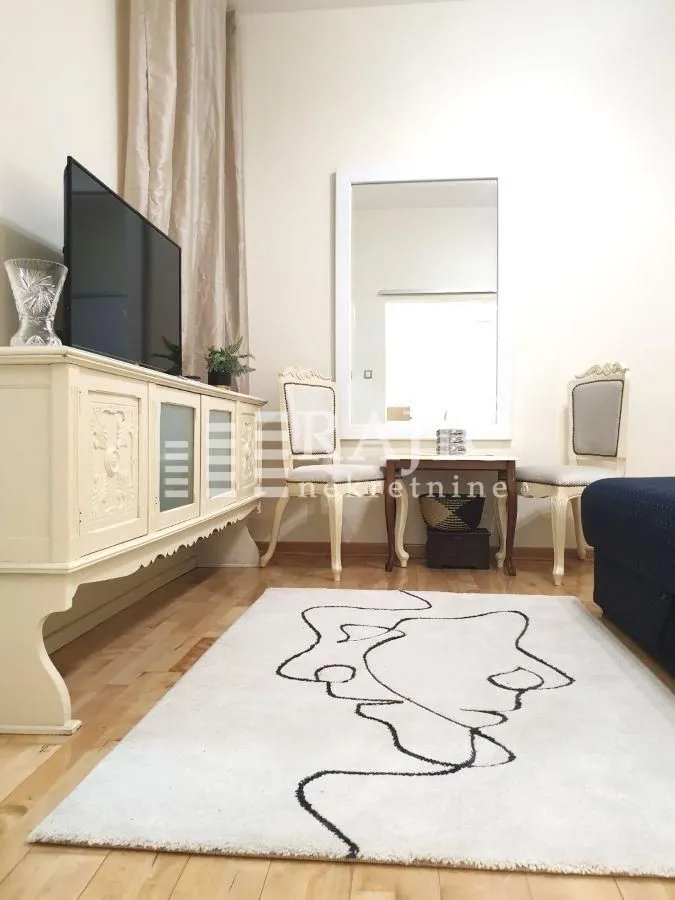 Living room with furniture, sideboard, and dining table.