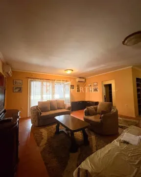 Living room with a sofa, armchair, coffee table, and access to the terrace. - image 5