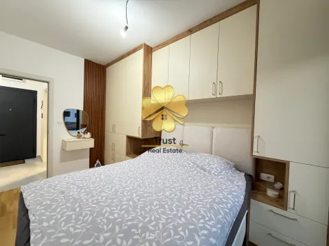 Furnished bedroom with a double bed and built-in wardrobes. - image 12