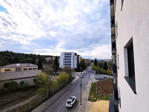 View from the terrace overlooking the street and surrounding buildings. - image 14