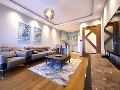 Modern and tidy living room connected to the kitchen. - image 3